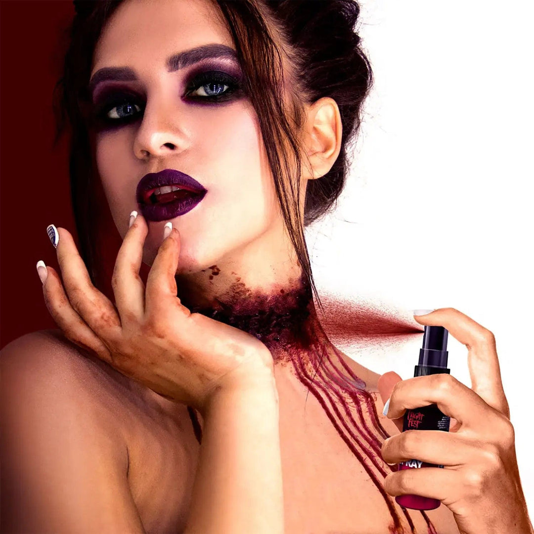 Female spraying fake blood onto her neck for Halloween special effects