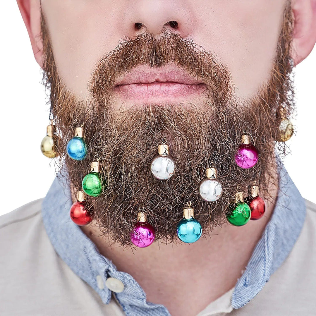 Man with 12 Christmas tree style baubles clipped on to his beard fro Christmas parties