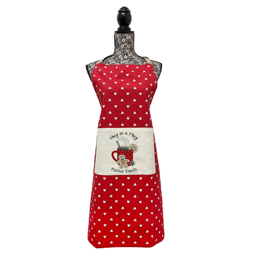 Christmas apron in red with hug in a mug festive treats slogan, gingerbread man and all over white heart print