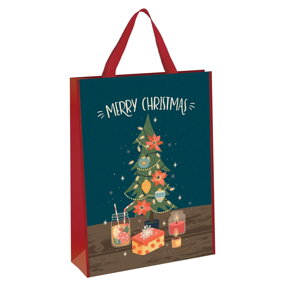 Large Christmas gift bag with red handles and printed image of a Christmas tree with Merry Christmas text