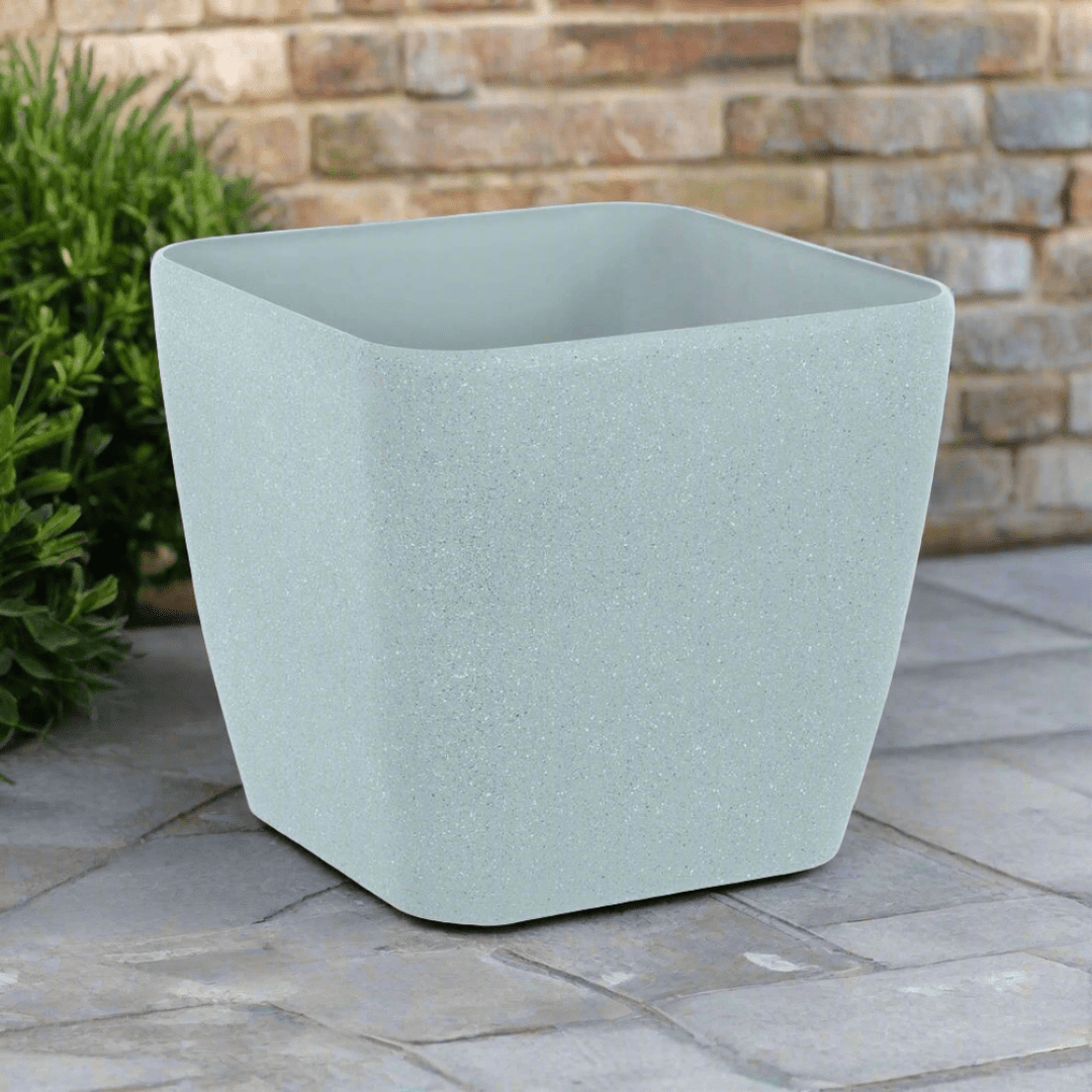 Grey Sandstone Effect Square Plastic Plant pot on a Patio