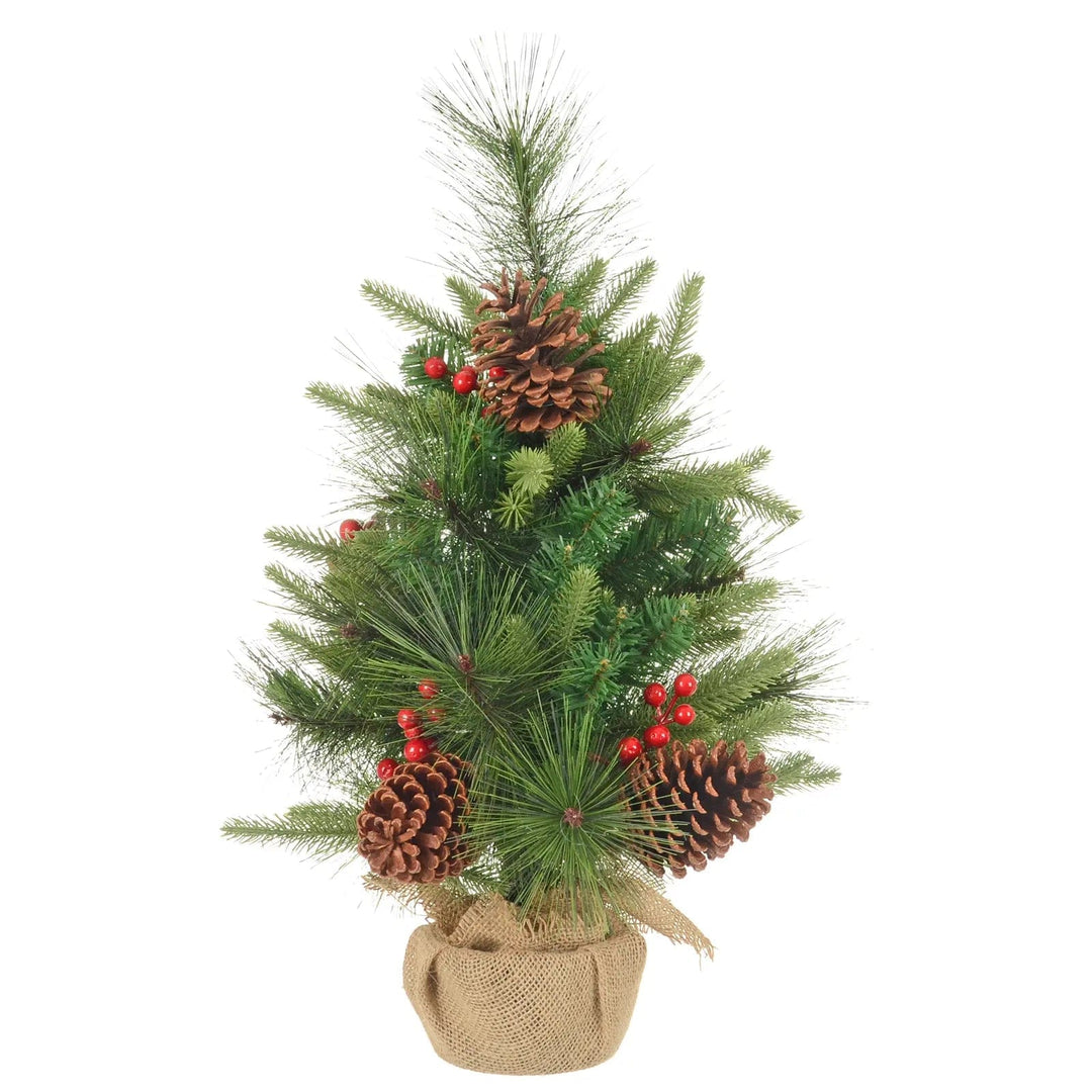 Small green pine Christmas tree with red berries, pine cones and a jute fabric base