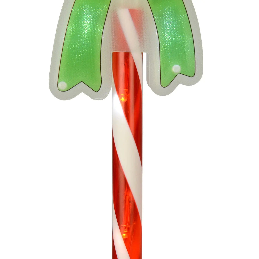 Close up of the LED lights inside the candy cane stripe Christmas pathway light with green bow