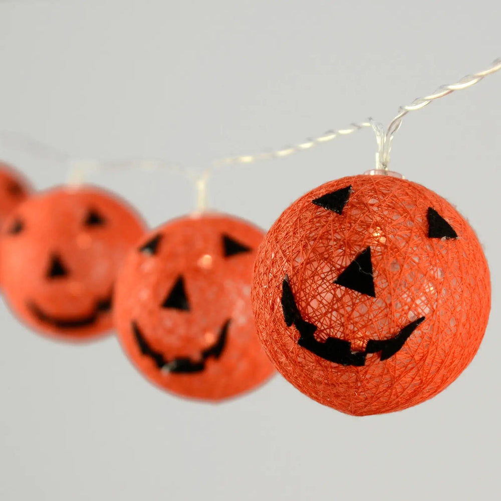 Light up Halloween Pumpkin string lights with clear wire and warm white LED lights