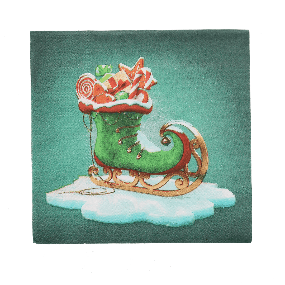 single green elf boot/santa sleigh napkin design show filled with christmas gifts on an ice block