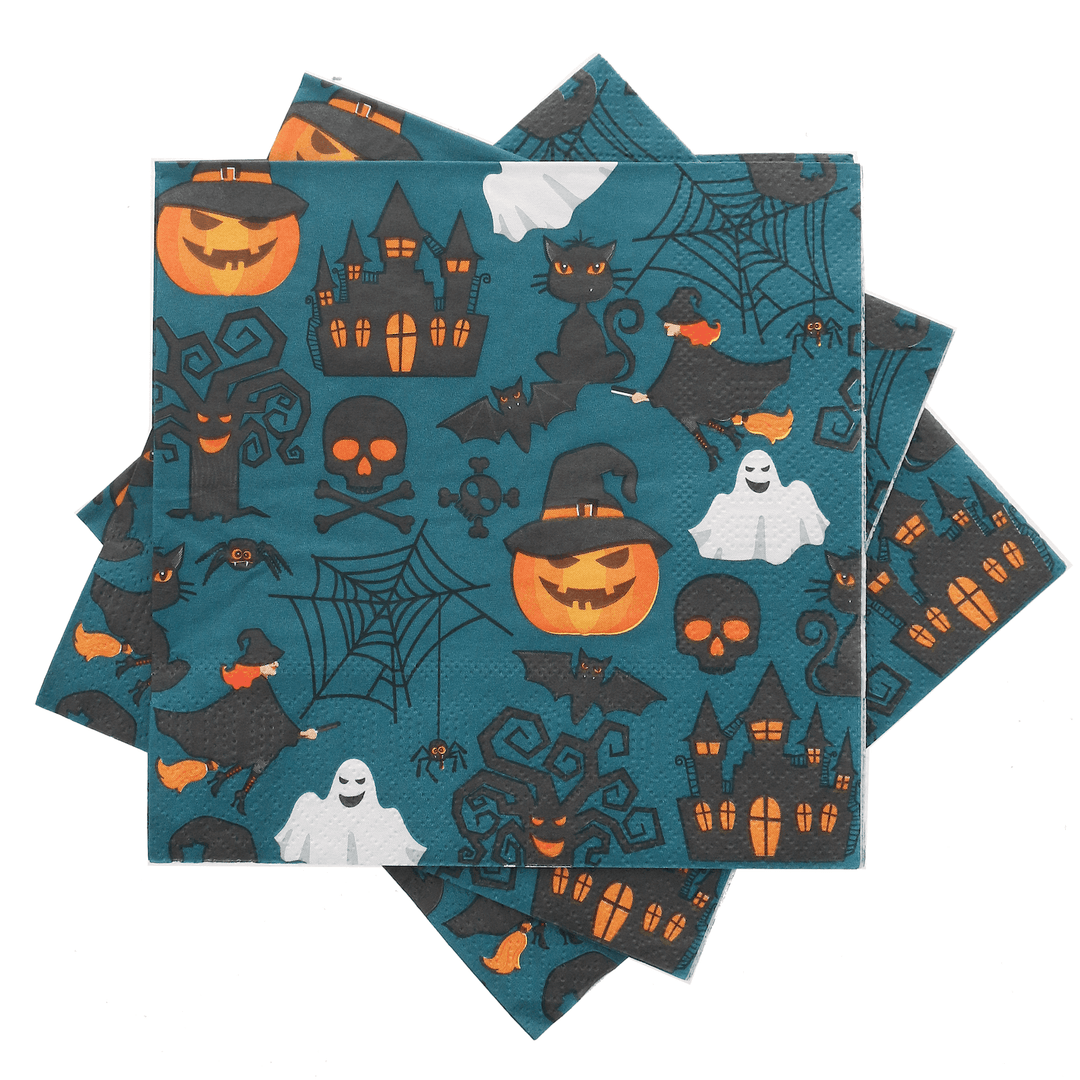 Napkins spread out and piled together featuring fun pattern with haunted houses, pumpkins, ghosts, cats, cobwebs on a blue background