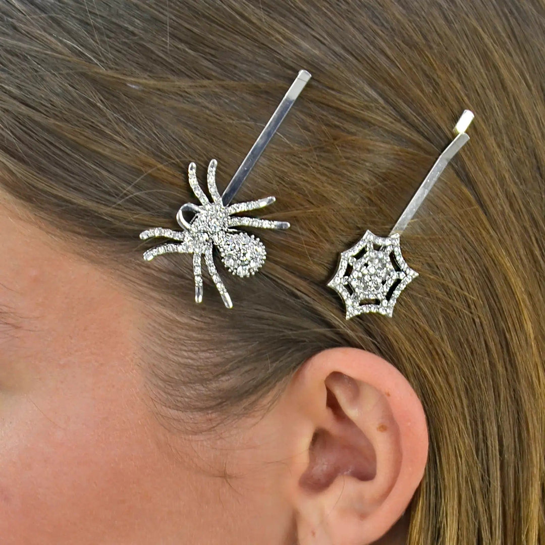 Model wearing 2 silver hair clips with diamante spider and web decoration for Halloween costume jewellery