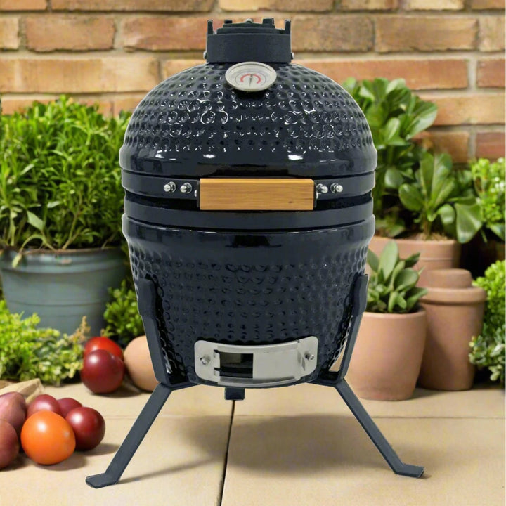 Egg shaped ceramic barbecue with bamboo handle and temperature gauge