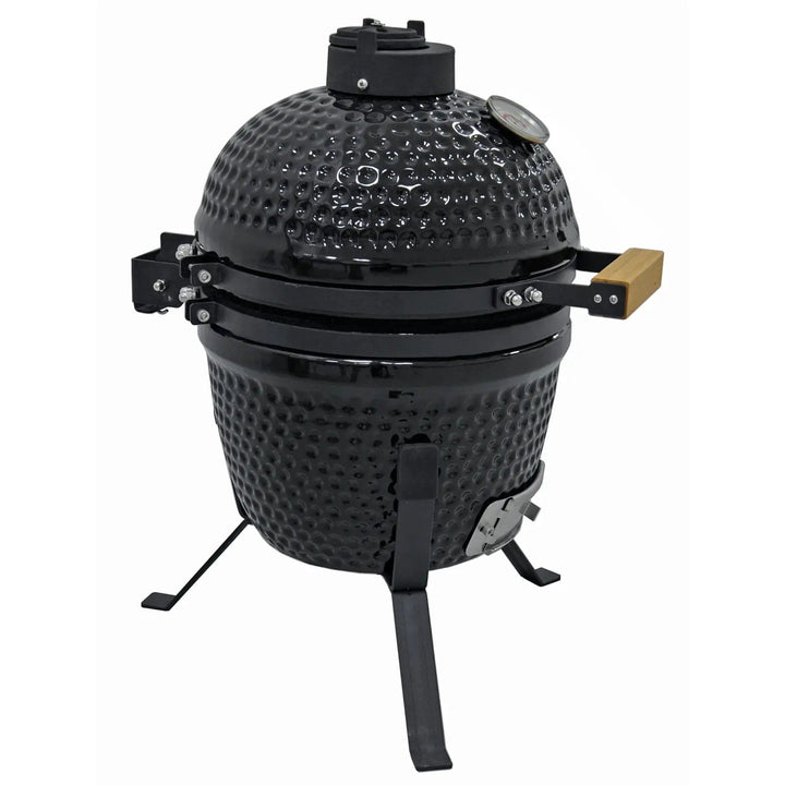 Side view of ceramic barbecue with hinged lid, 3 legs and a bamboo handle