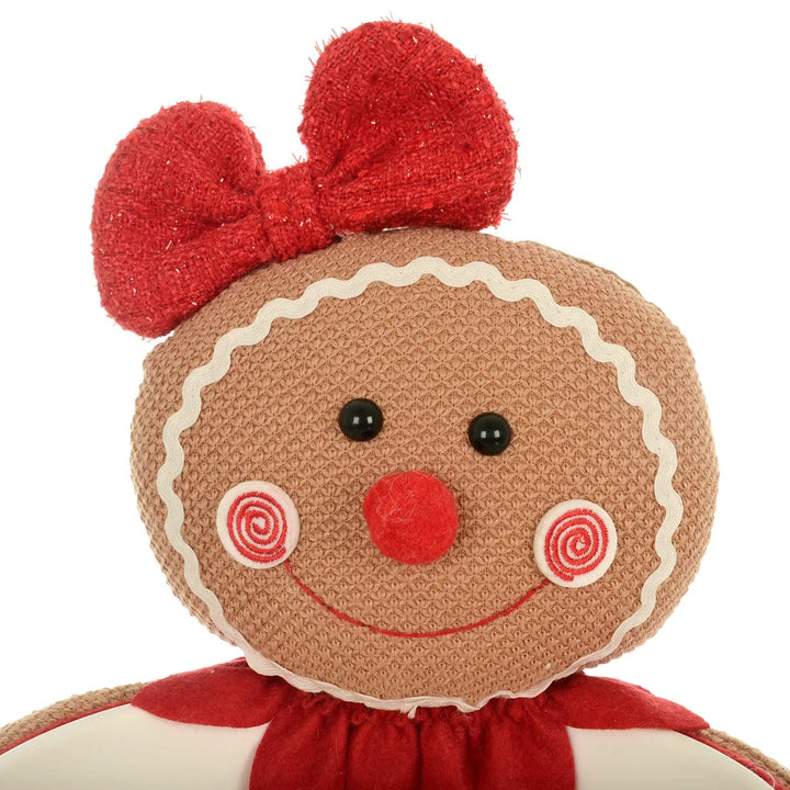 Detail of fabric gingerbread lady  Christmas candy bowl with red glitter hair bow