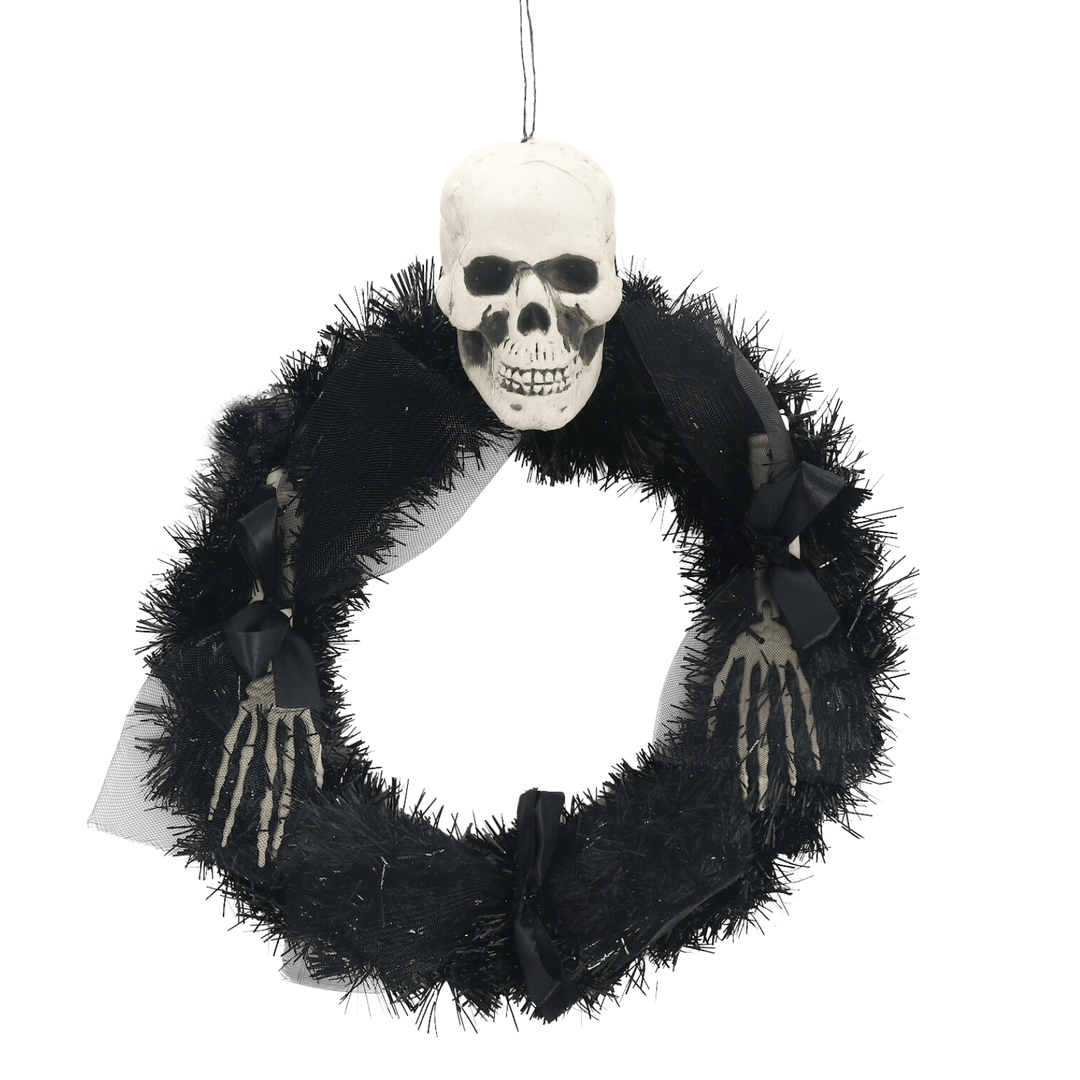 black tinsel wreath featuring skeleton head and arms with bows and organza material
