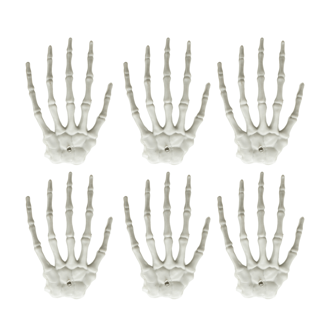 6 mini skeleton hand decorations on white background