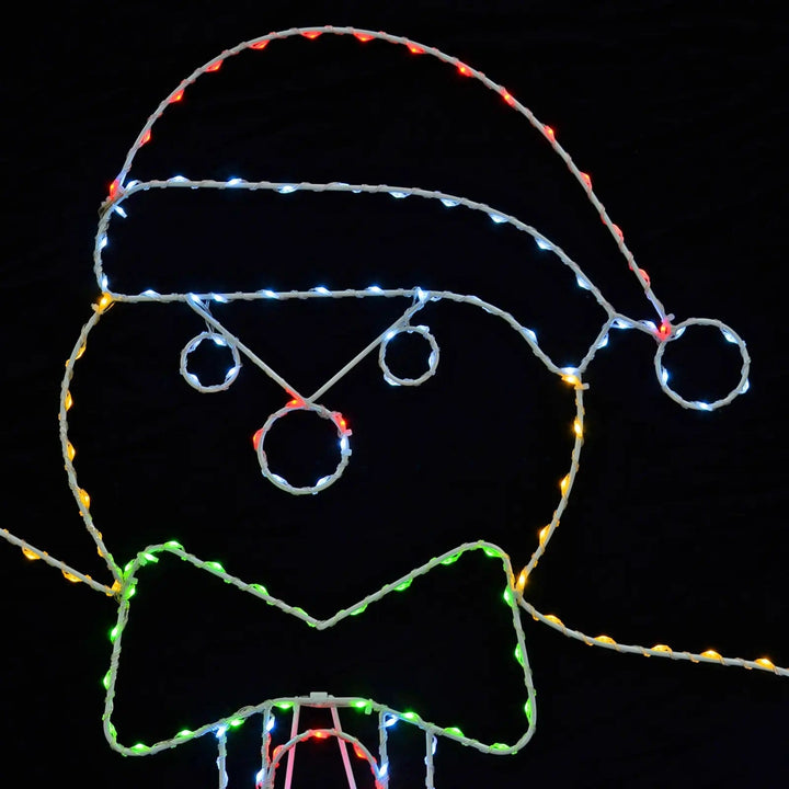 Close up of the face of a Christmas gingerbread man silhouette decoration with multicolour LED lights