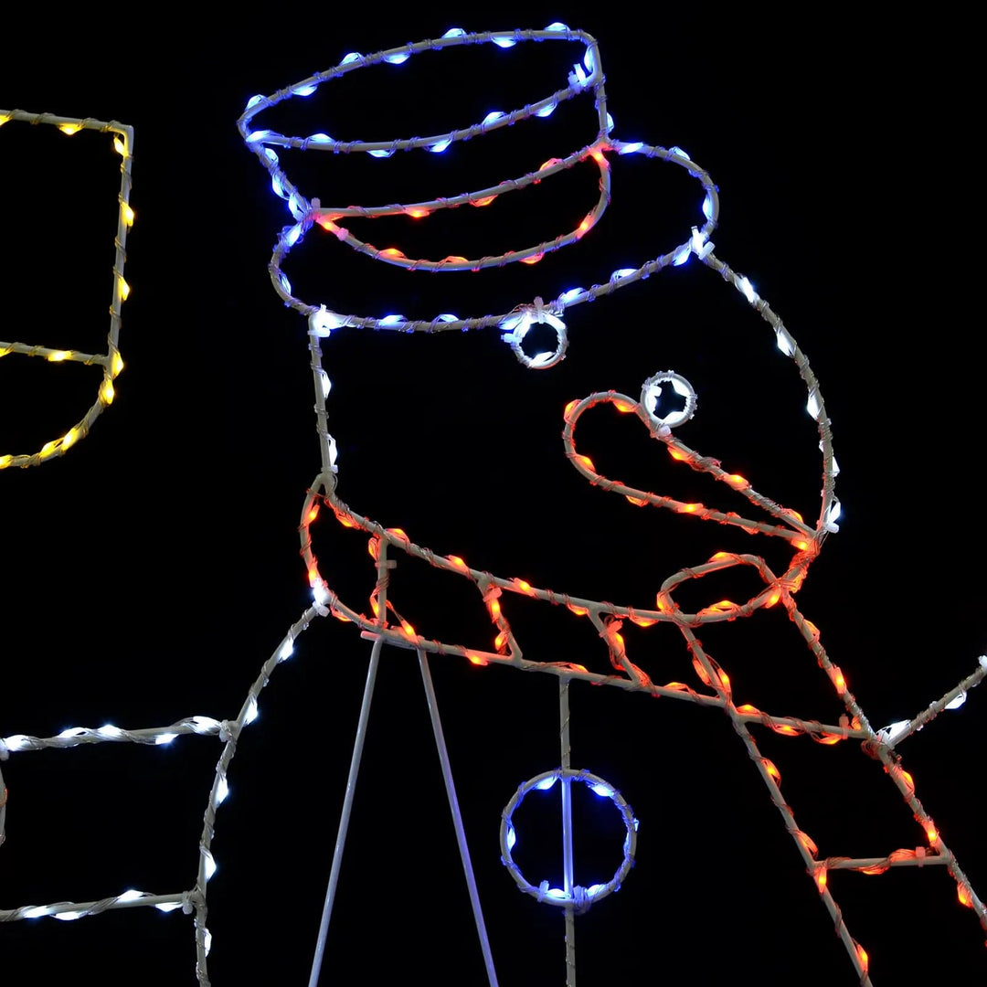 Detail of face of a Christmas snowman silhouette decoration with multicolour LED lights