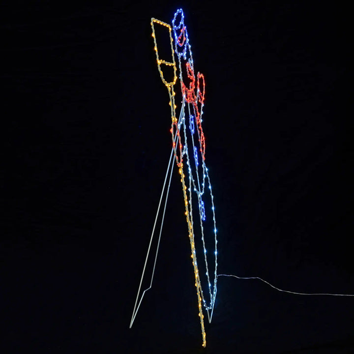 Side profile of a Snowman Christmas silhouette light with multicolour LED lights and stand