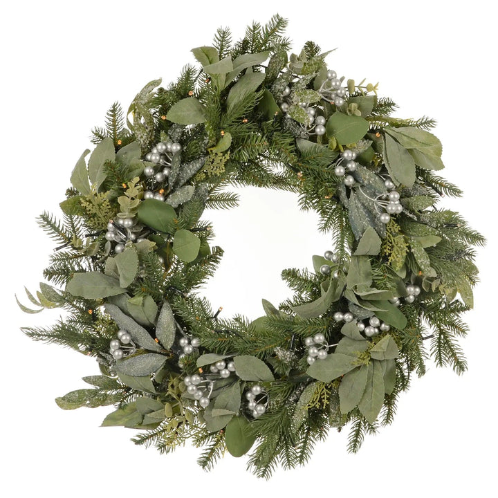 Green foliage Christmas wreath with silver berries and warm white lights