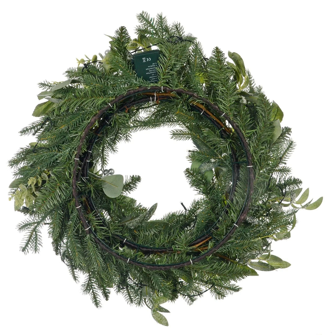 Back view of a Christmas wreath sowing double ring base and green pine branches