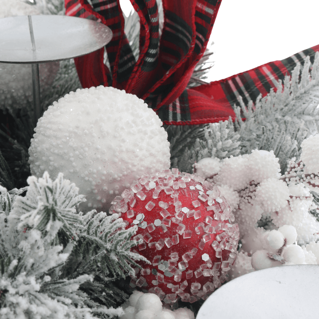 detail shot of frosted baubles in white and red colours