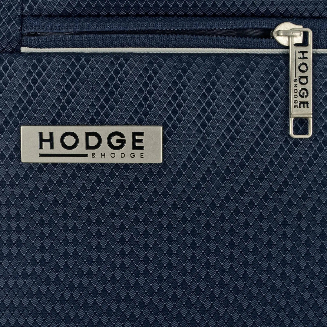 Close up of the branding and zip pull on a navy suitcase