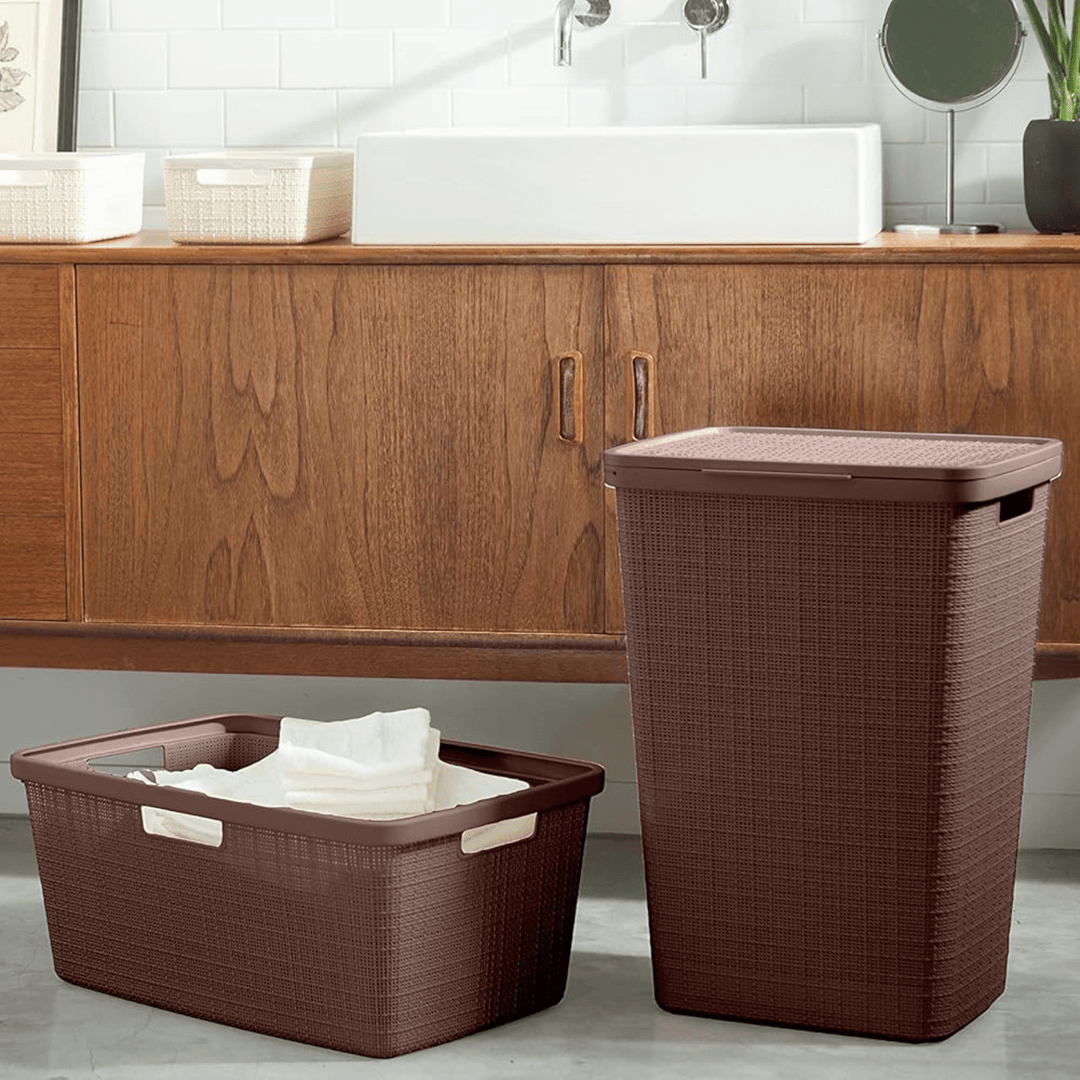 curver laundry hampers in 2 sizes in front of wooden storage cabinet in bathroom